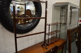 A mahogany towel rail and a wall shelf.