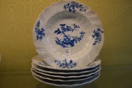 Six blue and white decorated dishes.