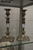 A pair of silver plated candlesticks.