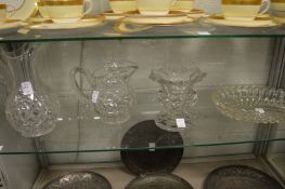Two cut glass jugs, a pedestal vase and a dish.