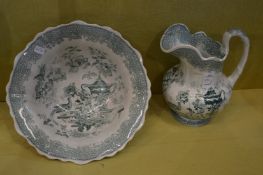 A small jug and bowl set.