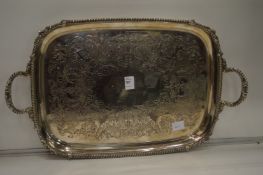 A plated twin handled tray with engraved decoration.