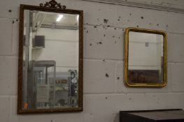Two gilt framed mirrors.