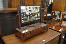 A 19th century mahogany dressing table mirror with three drawers to the base.