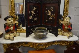 A pair of carved and painted wood seated Chinese figures of a boy and a girl.