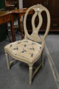 A continental grey painted dining chair.