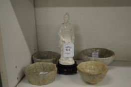 A small blanc-de-chine figure of a Chinese man and four small crackle ware bowls.