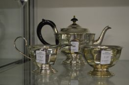 A decorative three piece tea service.