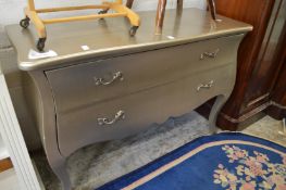 A silver painted two drawer commode.