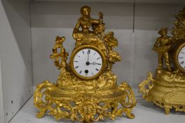 A French gilt metal mantle clock.