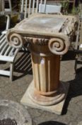 A good composite garden pedestal modelled as an Ionic column.