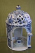 A Delft blue and white lantern.