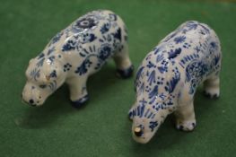 A Dutch blue and white pottery model of a hippo and a rhino.