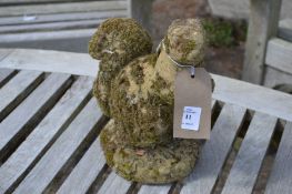 A garden ornament modelled as a squirrel.