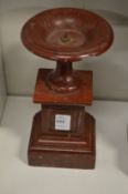A small rouge marble pedestal tazza.