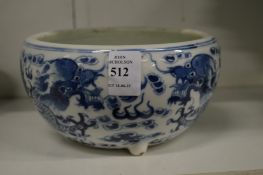 A Chinese blue and white porcelain bowl decorated with dragons.