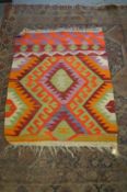 A colourful Kilim rug.