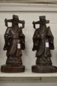A pair of Chinese carved hardwood figures depicting immortals.