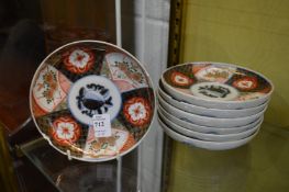 Seven small Imari plates.
