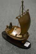 An unusual ormolu shell and marble model of a sailing boat.