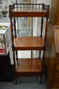 A 19th century mahogany three tier what-not with a drawer to the base.