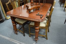 A Victorian and later mahogany extending dining table.