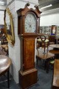 A 19th century oak and mahogany long case clock with painted arched dial.