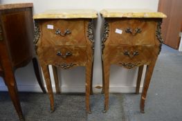 A pair of French inlaid walnut and marble topped two drawer petit commodes.