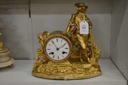 A decorative French gilt metal mantle clock.