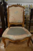 An upholstered French style occasional chair.