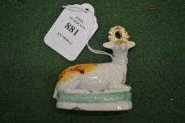 A miniature Staffordshire model of a recumbent stag.