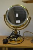 A magnifying, illuminated makeup mirror.