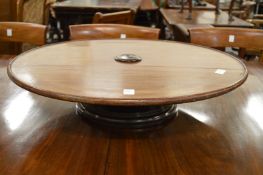 A mahogany circular revolving lazy Susan.