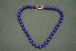 A lapis lazuli necklace.