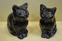 Two pottery black cats.