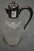 A good silver mounted cut and moulded glass claret jug.