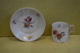 A Berlin floral decorated cup and saucer.