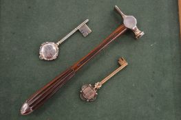 A pair of silver and silver gilt presentation keys and a presentation hammer.