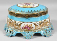 A LARGE RUSSIAN STYLE BLUE PORCELAIN OVAL SHAPED CASKET edged in gilt and painted with flowers.