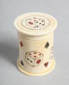 A HAND CARVED BONE DICE SHAKER. 1.75ins