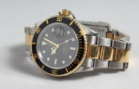 A ROLEX TWO TONE SUBMARINER WRISTWATCH, along with original invoice. Model A 16613, Serial no.