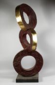A LARGE ABSTRACT BRONZE THREE CIRCLES on a square base. 4ft 5ins high.