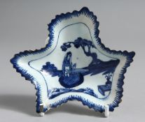 A BOW LEAF SHAPED PICKLE DISH painted with the rare Koto player in underglaze blue