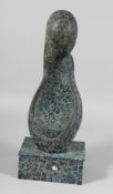 AN ABSTRACT BRONZE FIGURE. 17ins high.