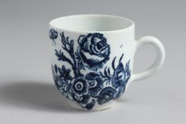 A RARE BOW PRINTED COFFEE CUP with a rose, insects and other flowers.