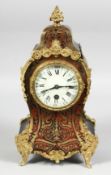 A GOOD 19TH CENTURY FRENCH GILT METAL BOULLE CLOCK with ornate numerals and cream dial. 12ins high.