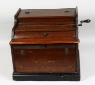 THE IMPROVED CELESTINA with paper roll, handle to the side, lift up lid and small drawer. 14ins