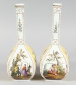 A GOOD PAIR OF AUGUSTUS REX DRESDEN BOTTLE VASES yellow panels with flowers and panels of figures. A