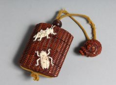 A JAPANESE WOOD INRO with bone insects. 2.75ins on a rope.
