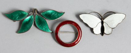 THREE SILVER AND ENAMEL BROOCH.
